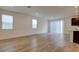 Bright living room with lots of natural light and neutral hardwood floors at 8909 Cherry Barn St, Las Vegas, NV 89113