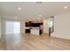 Spacious living room with abundant light, sleek hardwood flooring, and an open floorplan at 8909 Cherry Barn St, Las Vegas, NV 89113