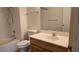 Bathroom with shower-tub combo, single sink vanity, and neutral tile flooring at 9070 Spring Mountain Rd # 209, Las Vegas, NV 89117