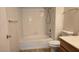 Bathroom with shower-tub combo, single sink vanity, and neutral tile flooring at 9070 Spring Mountain Rd # 209, Las Vegas, NV 89117