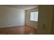Cozy bedroom with wood floors, bright window, and neutral color scheme at 9070 Spring Mountain Rd # 209, Las Vegas, NV 89117