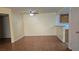 Open-concept living space with wood floors connecting to kitchen at 9070 Spring Mountain Rd # 209, Las Vegas, NV 89117
