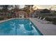 Community swimming pool with lounge chairs and shade. Perfect for relaxation and recreation at 9070 Spring Mountain Rd # 209, Las Vegas, NV 89117