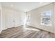 This bedroom has two bright windows, wood floors, and a closet at 9303 Gilcrease Ave # 1243, Las Vegas, NV 89149