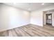 Bedroom features wood floors, a view of the ensuite bathroom, and bright, white walls at 9303 Gilcrease Ave # 1243, Las Vegas, NV 89149