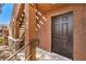 Front entry features secure door, staircase, and stucco exterior walls at 9303 Gilcrease Ave # 1243, Las Vegas, NV 89149