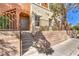 Exterior of home with stairs leading to private entrance and small patio area at 9303 Gilcrease Ave # 1243, Las Vegas, NV 89149