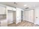 Spacious kitchen with white cabinets, white quartz countertops and wood-look flooring at 9303 Gilcrease Ave # 1243, Las Vegas, NV 89149