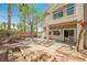Backyard featuring a patio, desert landscaping, palm trees, and a fence at 9490 Thunder Sky St # 102, Las Vegas, NV 89178