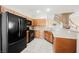 Functional kitchen featuring stainless steel appliances, tile backsplash, and ample cabinet space at 9490 Thunder Sky St # 102, Las Vegas, NV 89178