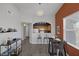 Charming dining area leading to kitchen, with dark floors and comfortable seating at 10001 Peace Way # 2351, Las Vegas, NV 89147