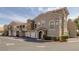 Well-maintained exterior of a multi-unit building with garages and manicured landscaping at 10001 Peace Way # 2351, Las Vegas, NV 89147