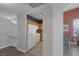 Open-concept kitchen with white appliances, wooden cabinets, and a breakfast bar for casual dining at 10001 Peace Way # 2351, Las Vegas, NV 89147
