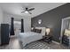 Stylish bedroom with dark accent wall, modern furnishings, and ample natural light at 10001 Peace Way # 2351, Las Vegas, NV 89147