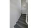 Carpeted stairway leads to the upper level of this condo, offering a smooth transition between floors at 10001 Peace Way # 2351, Las Vegas, NV 89147