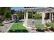 Outdoor area with green space, a quaint gazebo, and garden area providing a perfect space for relaxation at 10015 Wonderful Day Dr, Las Vegas, NV 89148