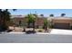 Charming single story home with a tile roof, low maintenance landscaping, and an attached two car garage at 10015 Wonderful Day Dr, Las Vegas, NV 89148
