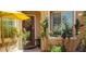 Inviting front porch adorned with roses, leading to a charming home with a lovely entry at 10015 Wonderful Day Dr, Las Vegas, NV 89148