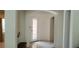 Bright hallway with tiled floors and a view of the front door with glass inserts at 10015 Wonderful Day Dr, Las Vegas, NV 89148