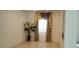 Bright living room with tiled floors and large windows with elegant curtains and a leafy potted plant at 10015 Wonderful Day Dr, Las Vegas, NV 89148