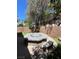 Backyard with a fire pit and bench at 10974 Fintry Hills St, Las Vegas, NV 89141