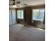 Carpeted bedroom with lots of natural light and modern ceiling fan at 10974 Fintry Hills St, Las Vegas, NV 89141