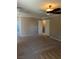 Spacious primary bedroom with carpet and neutral color, with view to the bathroom at 10974 Fintry Hills St, Las Vegas, NV 89141