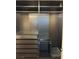 Walk in closet with multiple drawers, rods and shelving for optimal organization at 10974 Fintry Hills St, Las Vegas, NV 89141