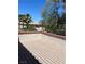 A wooden deck showcases the beautiful landscaping and a glimpse of the surrounding neighborhood at 10974 Fintry Hills St, Las Vegas, NV 89141