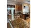 Kitchen featuring granite countertops, stainless steel appliances, and ample storage at 10974 Fintry Hills St, Las Vegas, NV 89141