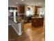 Kitchen featuring island, stainless appliances, granite counters, and natural light at 10974 Fintry Hills St, Las Vegas, NV 89141