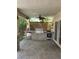 Outdoor kitchen with stone surround, stainless steel grill and appliances, and a covered patio area at 10974 Fintry Hills St, Las Vegas, NV 89141