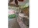 Well-equipped outdoor kitchen with stone accents and built-in grill, perfect for entertaining at 10974 Fintry Hills St, Las Vegas, NV 89141