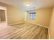 Bedroom with wood flooring, natural light, and neutral paint at 11083 Ketchikan St, Las Vegas, NV 89179