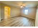 Bright bedroom with wood-style floors and a connecting bathroom with tub at 11083 Ketchikan St, Las Vegas, NV 89179