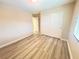Bedroom with wood floors, closet with sliding doors, and ample space at 11083 Ketchikan St, Las Vegas, NV 89179