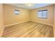 This bedroom features wood look floors, baseboards, natural light, and neutral color at 11083 Ketchikan St, Las Vegas, NV 89179