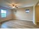 Bonus room featuring wood-style floors and a ceiling fan at 11083 Ketchikan St, Las Vegas, NV 89179