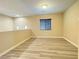 Open bonus room featuring wood-style floors, and neutral walls with white trim at 11083 Ketchikan St, Las Vegas, NV 89179