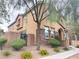 Inviting two-story home with manicured landscaping, stone accents, and a welcoming front entrance at 11083 Ketchikan St, Las Vegas, NV 89179