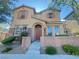 Charming two-story home featuring a well-maintained front yard with stone accents, and an inviting entrance at 11083 Ketchikan St, Las Vegas, NV 89179