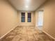 Open living room with tile flooring and natural light at 11083 Ketchikan St, Las Vegas, NV 89179