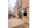 An outdoor patio with pavers and sliding glass door that leads into the home at 11083 Ketchikan St, Las Vegas, NV 89179