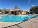 Community pool with mature landscaping and clear blue water at 11083 Ketchikan St, Las Vegas, NV 89179