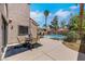 Inviting outdoor space with patio, table and chairs, with access to the pool at 124 Wynntry Dr, Henderson, NV 89074