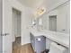 Cozy bathroom with laminate floor, grey vanity, with a large counter and toilet at 124 Wynntry Dr, Henderson, NV 89074