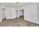 Neutral bedroom featuring carpet floors, a closet, and ample space with several doorways at 124 Wynntry Dr, Henderson, NV 89074