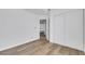 Bedroom with wood floors, white walls, and a closet, offering a simple design at 124 Wynntry Dr, Henderson, NV 89074