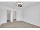 A clean and simple carpeted bedroom, with multiple entry ways and white walls at 124 Wynntry Dr, Henderson, NV 89074
