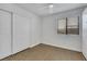 This bedroom features tile flooring, a window, and a ceiling fan at 124 Wynntry Dr, Henderson, NV 89074